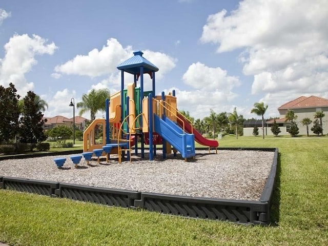 view of jungle gym featuring a lawn