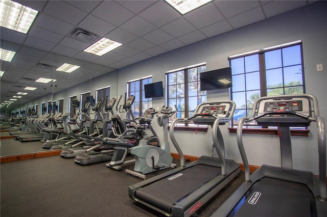 workout area with a paneled ceiling