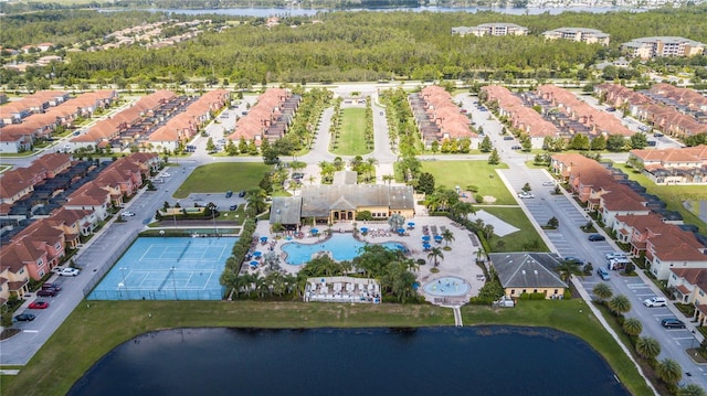 birds eye view of property with a water view