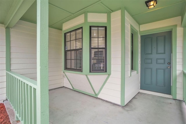 property entrance featuring covered porch