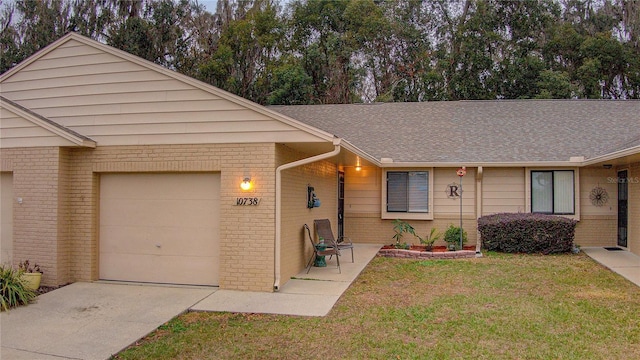 ranch-style house with a front lawn and a garage