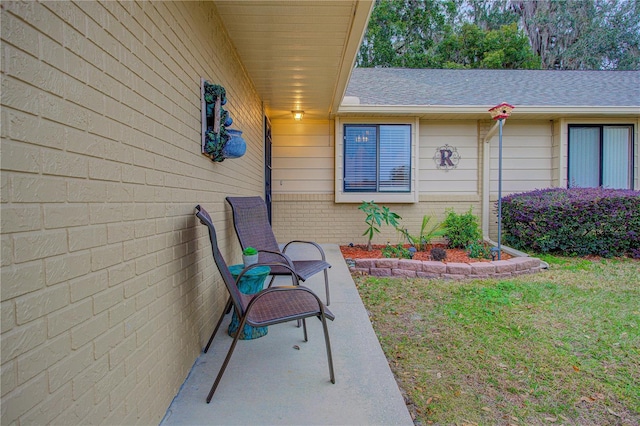 entrance to property featuring a yard