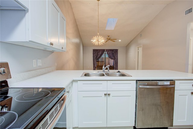 kitchen featuring sink, white cabinets, appliances with stainless steel finishes, and lofted ceiling