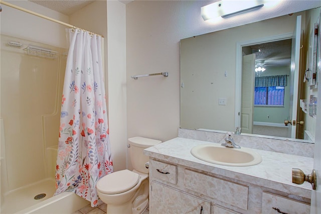 bathroom featuring toilet, vanity, tile patterned flooring, ceiling fan, and curtained shower