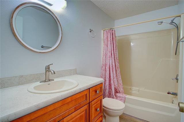 full bathroom featuring toilet, vanity, hardwood / wood-style flooring, a textured ceiling, and shower / tub combo with curtain