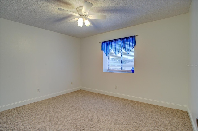 carpeted spare room with ceiling fan and a textured ceiling