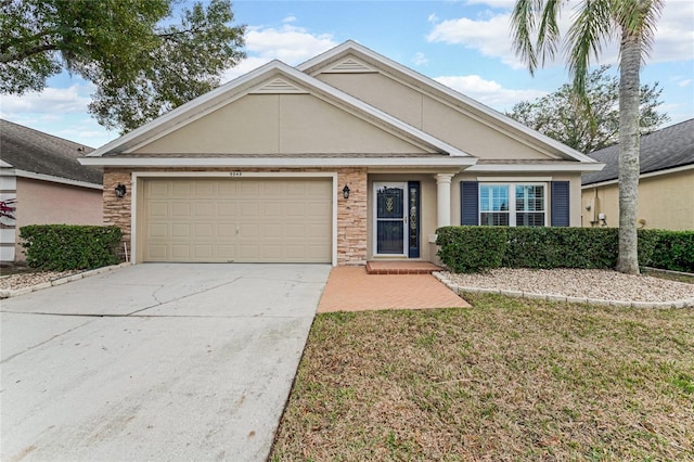 view of front of house featuring a front yard and a garage