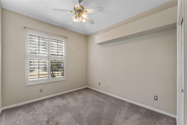 unfurnished room with a textured ceiling, light carpet, and ceiling fan