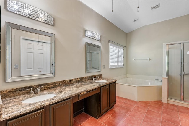 bathroom featuring separate shower and tub, tile patterned floors, vaulted ceiling, and vanity