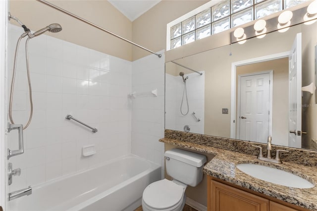 full bathroom with tiled shower / bath, vanity, and toilet