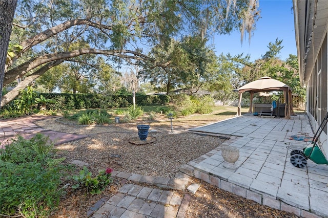 view of yard featuring a patio area and a gazebo