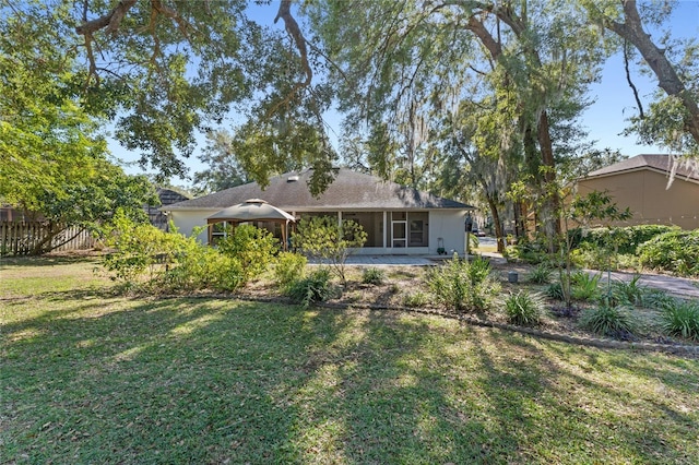 back of house featuring a yard