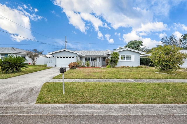 single story home featuring a porch, a front lawn, and a garage