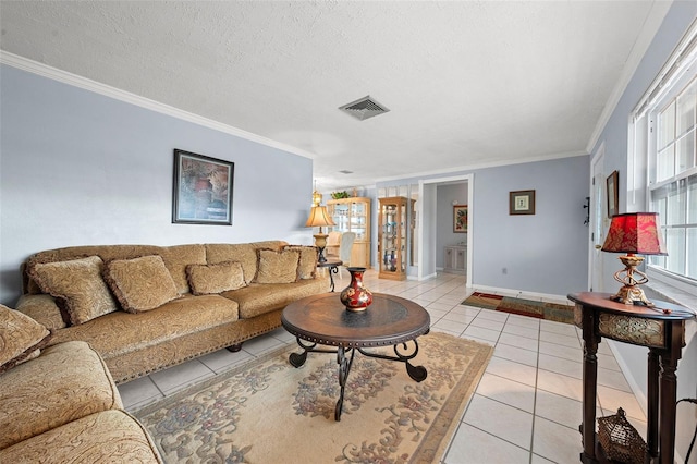 tiled living room featuring a textured ceiling and ornamental molding