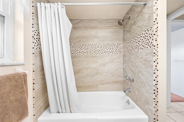 bathroom featuring tile patterned flooring and shower / bathtub combination with curtain