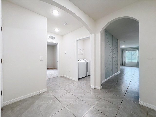 hall featuring washing machine and clothes dryer