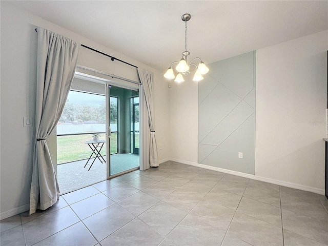 unfurnished room featuring light tile patterned floors and a chandelier