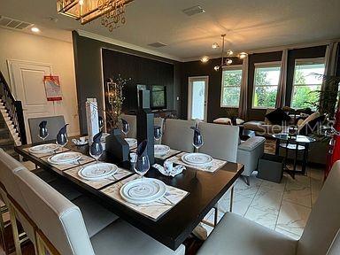 dining area with a notable chandelier