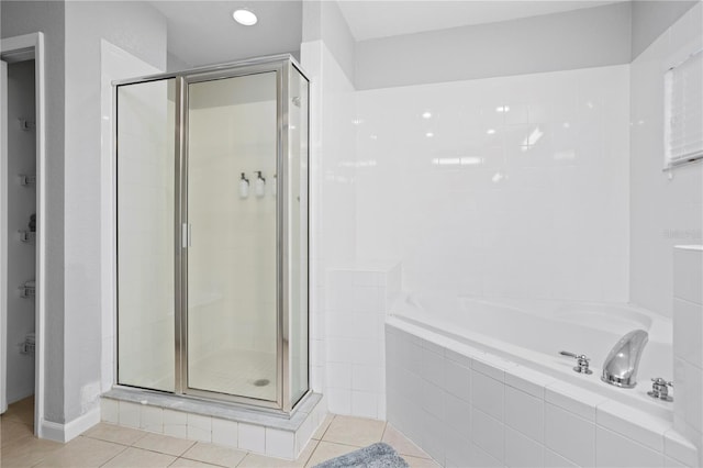 bathroom featuring independent shower and bath and tile patterned floors