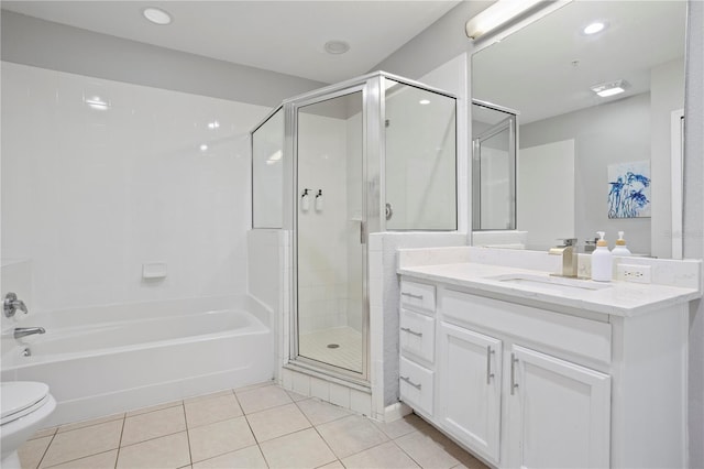 full bathroom with toilet, tile patterned flooring, separate shower and tub, and vanity