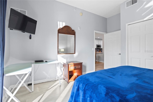 bedroom with light wood-type flooring