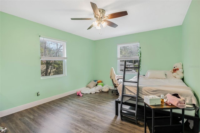 bedroom featuring ceiling fan and dark hardwood / wood-style floors