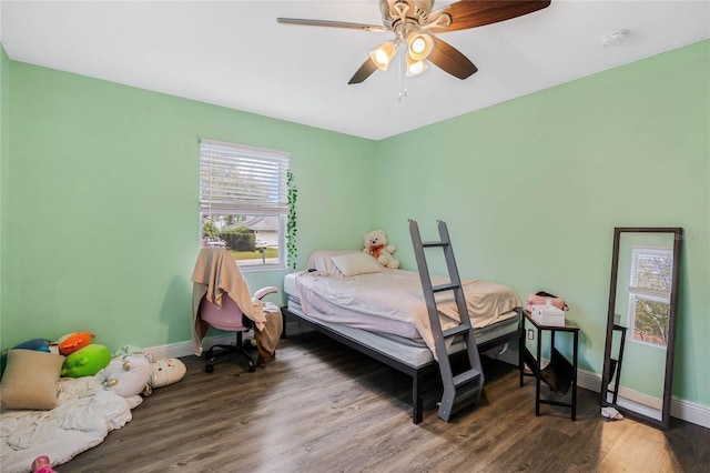 bedroom with ceiling fan and hardwood / wood-style floors