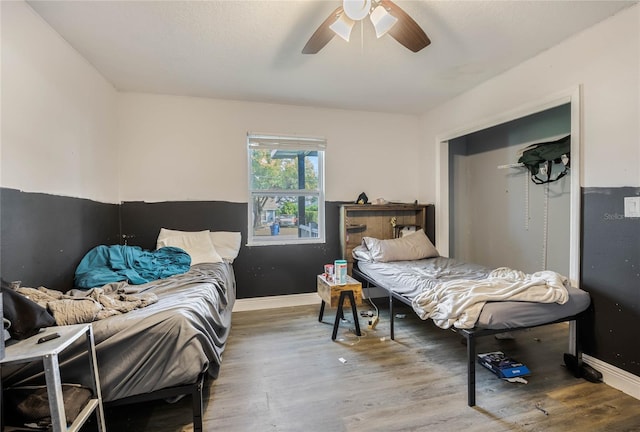 bedroom featuring ceiling fan and hardwood / wood-style flooring