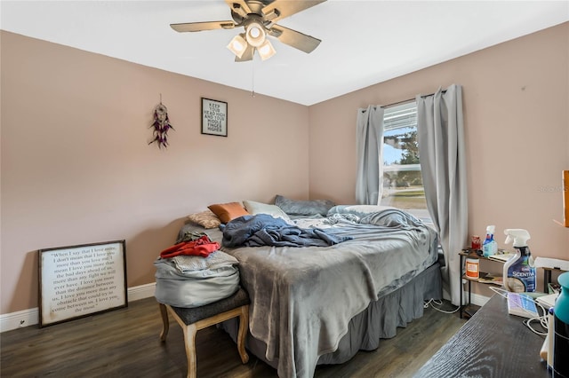 bedroom with ceiling fan and dark hardwood / wood-style floors