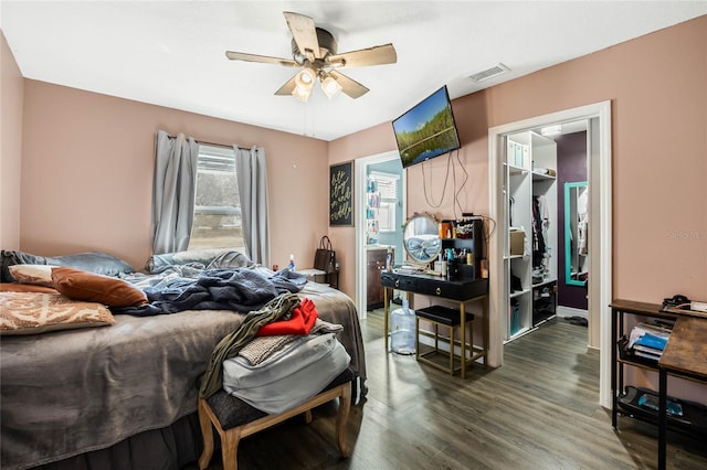 bedroom with ceiling fan and dark hardwood / wood-style floors