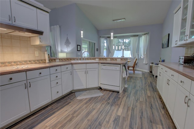 kitchen featuring white appliances, white cabinetry, and sink