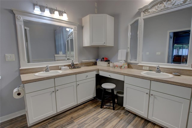 bathroom featuring wood-type flooring and vanity