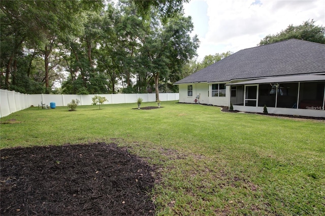 view of yard with a sunroom