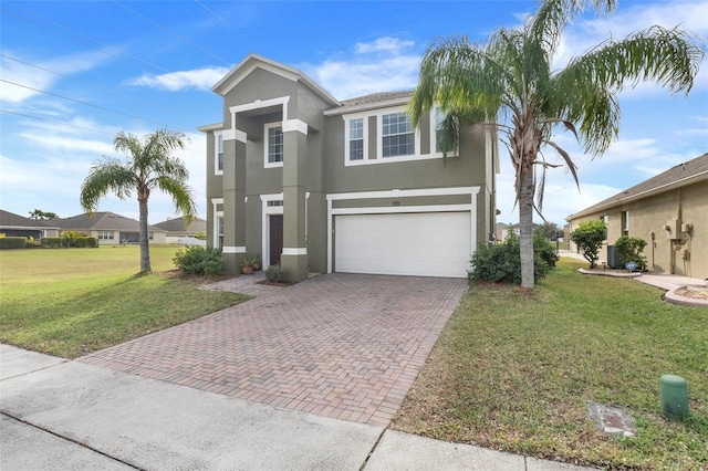 view of front of house with a front lawn and a garage