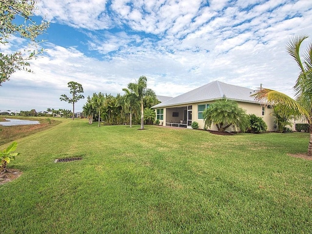 view of yard featuring a sunroom