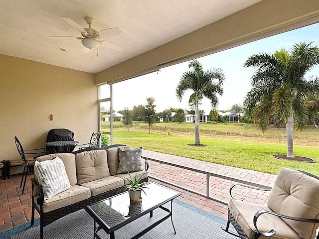 view of patio / terrace with ceiling fan and an outdoor hangout area