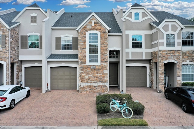 townhome / multi-family property featuring a garage