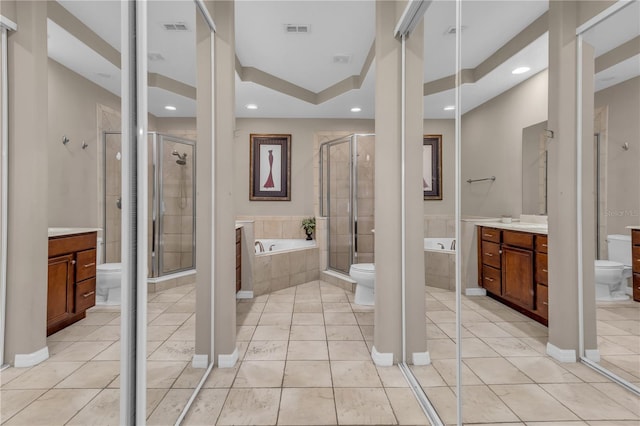 full bathroom featuring toilet, tile patterned floors, separate shower and tub, and vanity