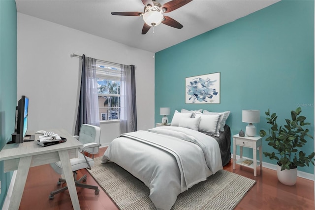 bedroom featuring ceiling fan and wood-type flooring