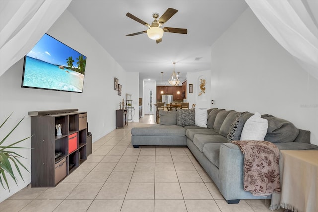 living room featuring ceiling fan and light tile patterned flooring