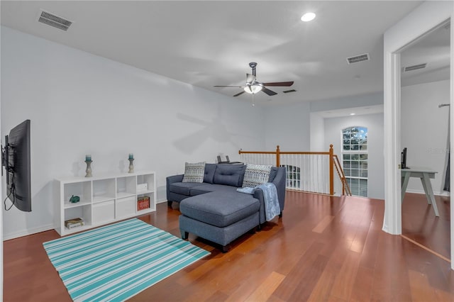 living room with ceiling fan and hardwood / wood-style flooring