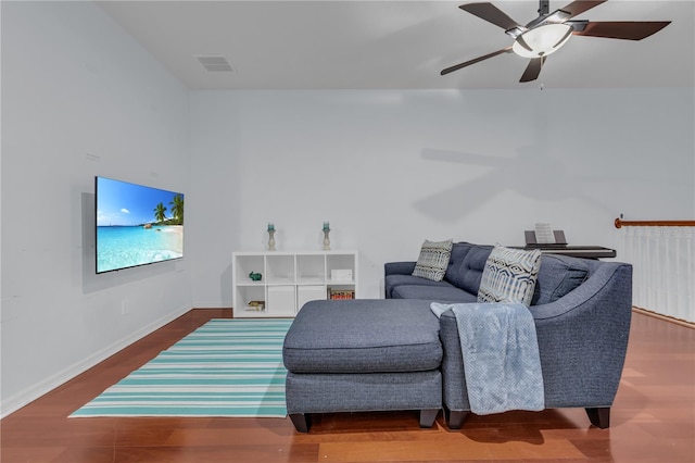 living room featuring ceiling fan and hardwood / wood-style flooring