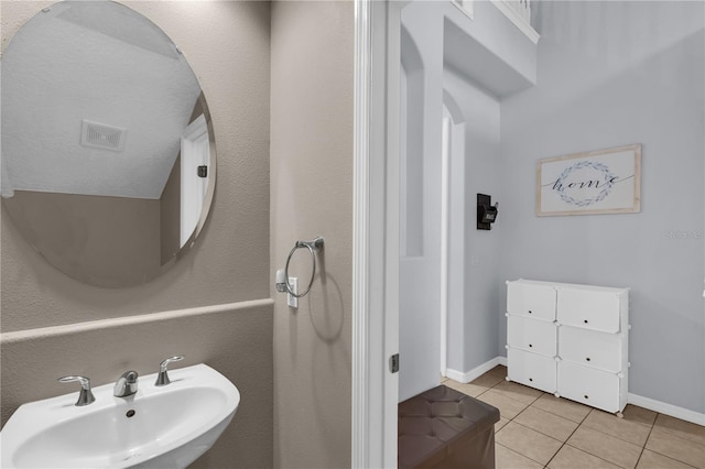 bathroom with sink and tile patterned floors