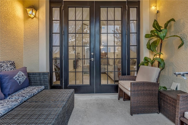 view of exterior entry featuring french doors