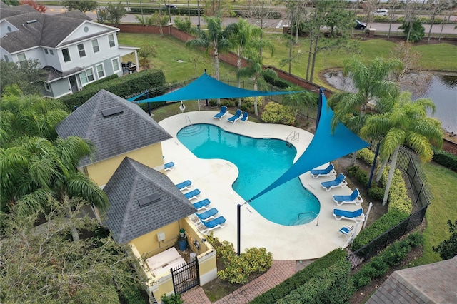 view of pool with a yard and a patio