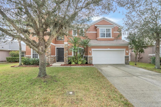 view of front facade with a front yard and a garage