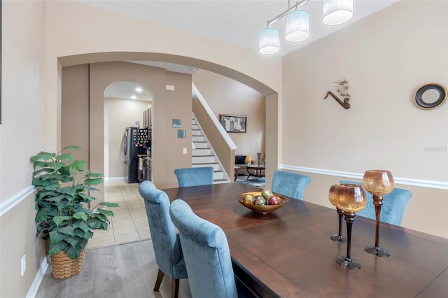 dining space with light wood-type flooring