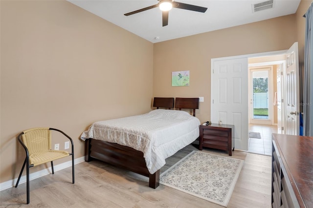 bedroom featuring ceiling fan and light hardwood / wood-style flooring