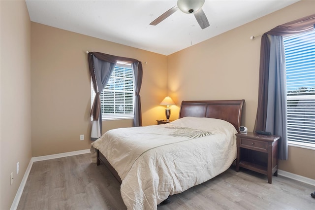 bedroom featuring ceiling fan and light hardwood / wood-style floors