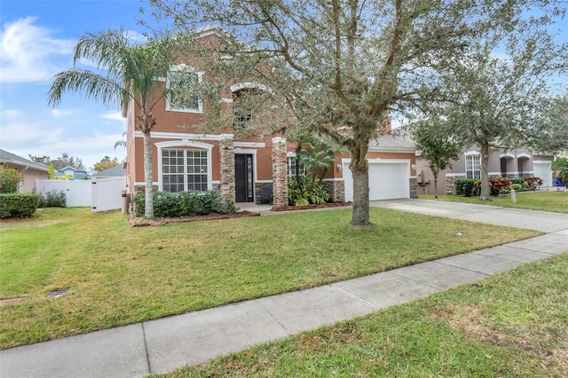 view of front of home featuring a garage and a front lawn